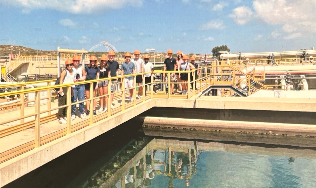 Northwestern students in hard hats visiting an Israeli water treatment facility